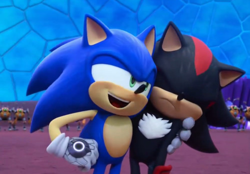 Screenshot of Sonic Prime, right after the one above. Sonic is now nuzzling into Shadow. Shadow, scowling, tolerates it.